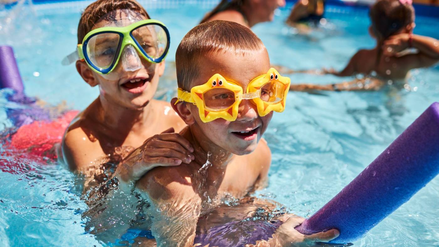 children playing in the pool